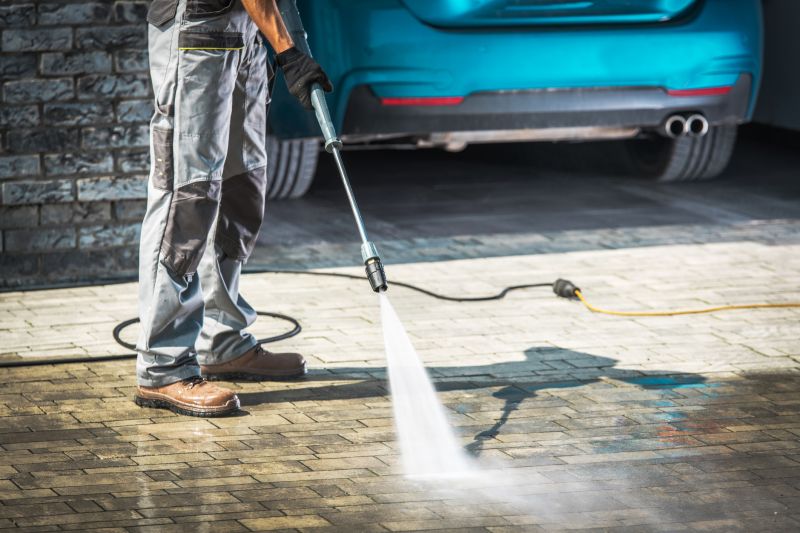 Power Washing in Action on a Driveway